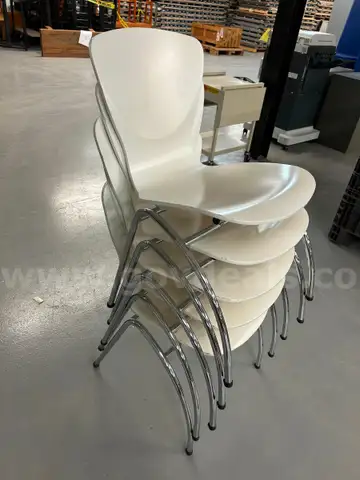 5 white Stack Chairs
