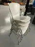 5 white Stack Chairs