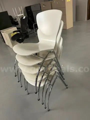 5 white Stack Chairs