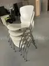 5 white Stack Chairs