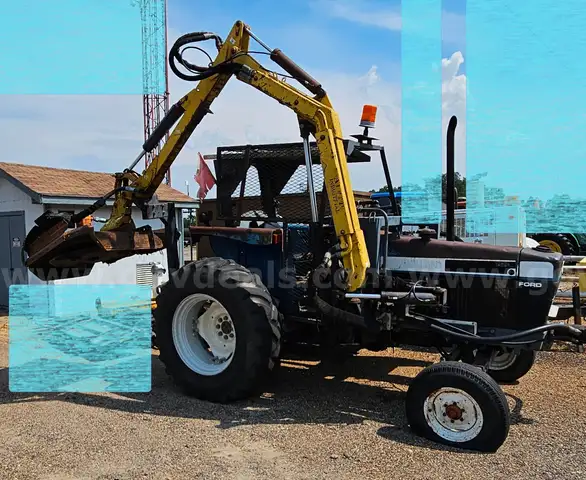 Ford tractor with alamo slope mower attached