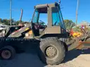 BACK HOE SCOOP LOADER