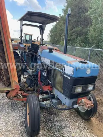 Holland Tractor with attachment (Mower Flail)