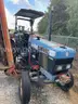 Holland Tractor with attachment (Mower Flail)