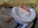 Assortment of Plastic Lids, Plates, and Plastic Bowls