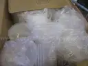 Assortment of Plastic Lids, Plates, and Plastic Bowls