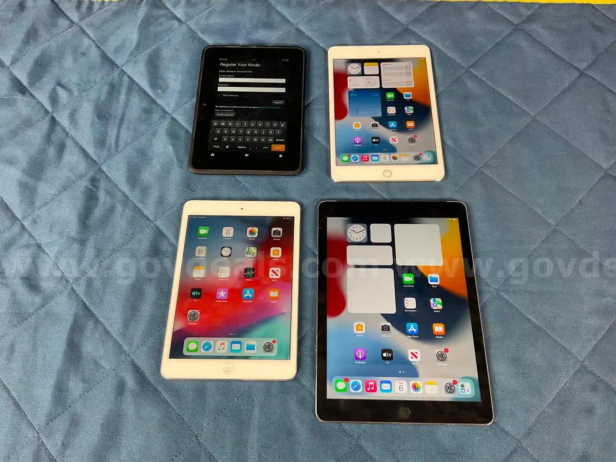 4 Tablets 3 Apple iPads and 1 Amazon Kindle Fire AllSurplus