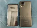 2 - Samsung Cell Phones (User-Locked) Both Power On