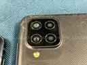 2 - Samsung Cell Phones (User-Locked) Both Power On