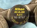 2 - Binoculars/Monoculars: 1 - Nikon Aculon A211 and 1 - Simmons 1204