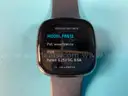 2 - FitBit Smart Watches (Unlocked) with Bands, Both Power On: 1 - Versa 2 Model FB507 and 1 - Sense Model FB512