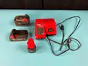 3 - Milwaukee RedLithium Battery Packs and 1 - Charger, All Power On and Charge