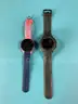 2 - Garmin Smart Watches (Unlocked) Both Power On: 1 - Forerunner 255S and 1 - Instinct 2