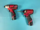 2 - Milwaukee Cordless 1/4" Hex Impact Drivers with Batteries, Both Power On