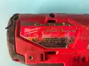 2 - Milwaukee Cordless 1/4" Hex Impact Drivers with Batteries, Both Power On