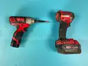 2 - Milwaukee Cordless 1/4" Impact Drivers with Batteries, Both Power On