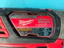 2 - Milwaukee Cordless 1/4" Impact Drivers with Batteries, Both Power On