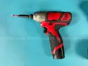 2 - Milwaukee Cordless 1/4" Impact Drivers with Batteries, Both Power On