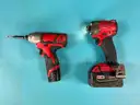 2 - Milwaukee Cordless 1/4" Impact Drivers with Batteries, Both Power On