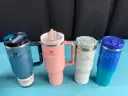 7 - Water Bottles, Labeled as: 5 - Stanley, 1 - Starbucks & 1 - YETI
