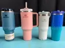 7 - Water Bottles, Labeled as: 5 - Stanley, 1 - Starbucks & 1 - YETI