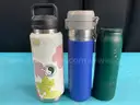 7 - Water Bottles, Labeled as: 5 - Stanley, 1 - Starbucks & 1 - YETI