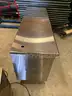 Refrigerators, drink cooler, chairs, safe, coffee maker, stainless steel tables, frozen drink machine.