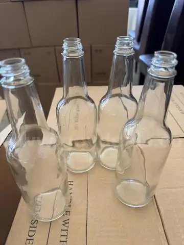 80 boxes of 10 OZ Glass Bottles and Black Plastic Bottle Caps