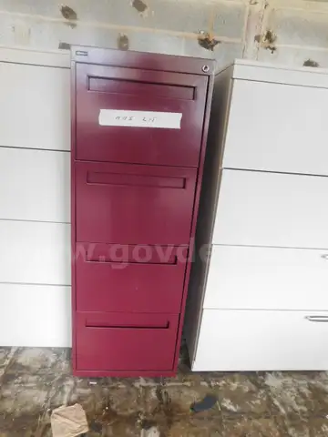 4 File Cabinets, 1- Black 4 drawer 1- Black 2- Drawer 1- wood and 1- 4 Drawer Burgandy