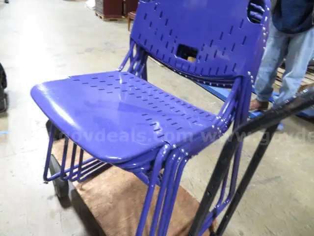 Four blue metal chairs