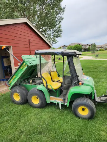 John Deere Gator with Plow Attachment