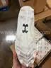 Lot of Approximately 100 Under Armour Cleats