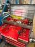 Multi-tiered tool cart with assorted items