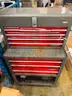 Multi-tiered tool cart with assorted items