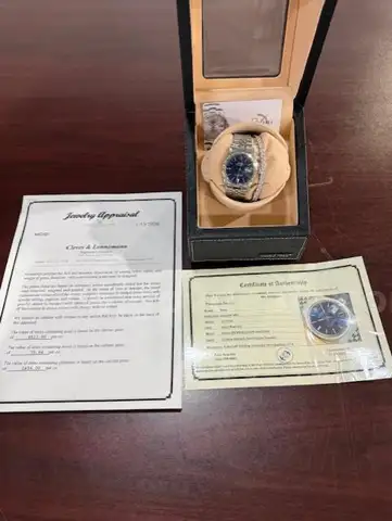 Rolex Watch and Bracelet in Display Case