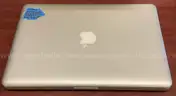 A MacBook Pro With Charger and Box
