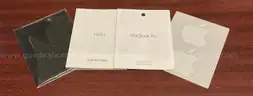A MacBook Pro With Charger and Box