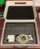 A MacBook Pro With Charger and Box