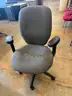 Grey Cushioned Rolling Chair