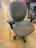 Grey Cushioned Rolling Chair