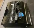 A Playstation 3 with Power Cable
