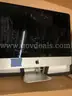 An iMac with Power Cord and Box