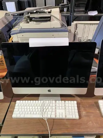 Two Apple iMac 21.5-inch computer