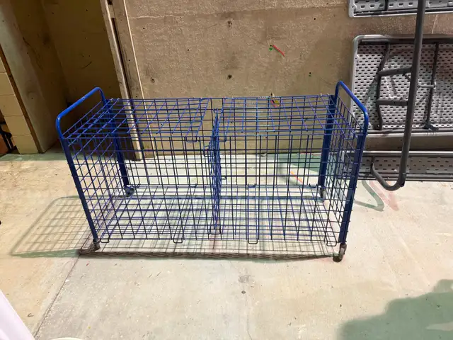 1 blue rolling cage cart