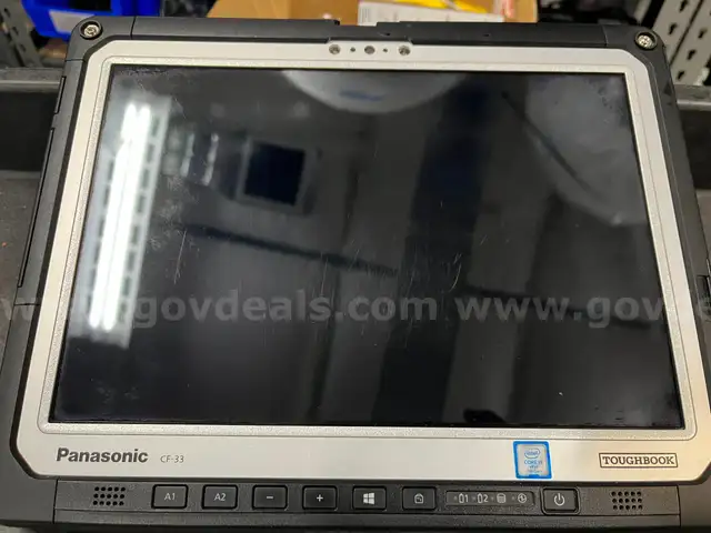 Lot of 5 Panasonic Toughbook CF-33s with docks, keyboards, and power supplies