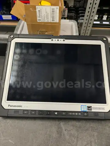 Lot of 5 Panasonic Toughbook CF-33s with docks, keyboards, and power supplies