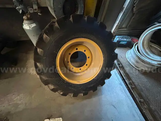 Firestone CAT Backhoe Wheels and Tires (4 total)  - Set of (2) front and (2) Rear