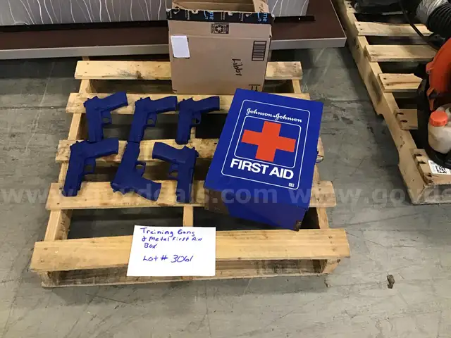 6 Blue solid training guns & a metal First Aid Box
