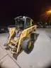 2007 John Deere 328 w/4 way bucket and asphalt grinder