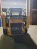 2007 John Deere 328 w/4 way bucket and asphalt grinder